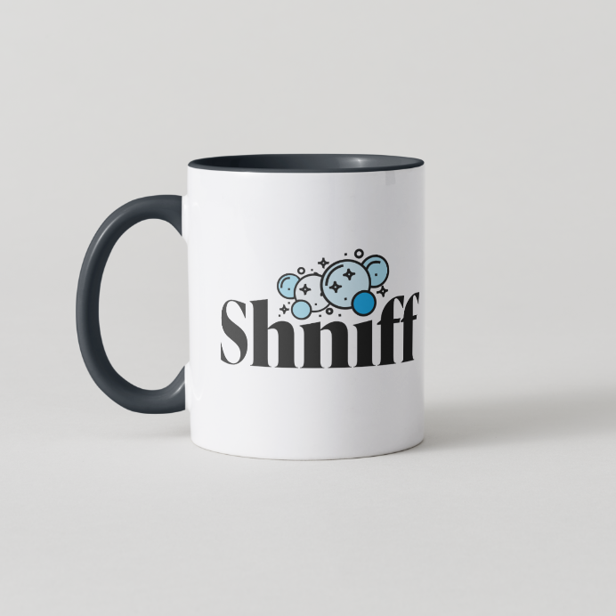 A white ceramic coffee mug with a black handle and black interior, featuring a graphic of three blue cartoon mice and the word 'Shniff' in black text on the front.
